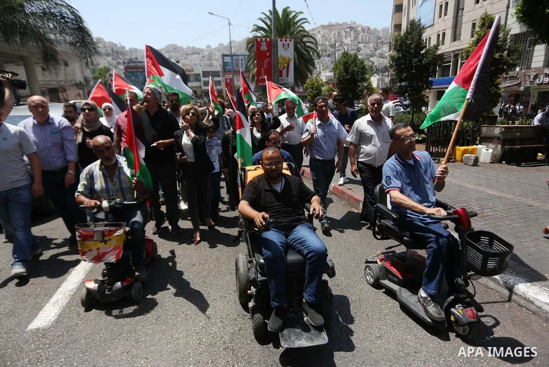 Palestinians take part in a protest in solidarity with the Gaza Strip, in the West Bank city of Nablus on August 7, 2022. The death toll from violence in Gaza has risen to 31, including six children, the health ministry...