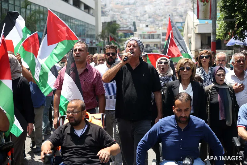 Palestinians take part in a protest in solidarity with the Gaza Strip, in the West Bank city of Nablus on August 7, 2022. The death toll from violence in Gaza has risen to 31, including six children, the health ministry...