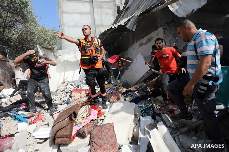 Palestinians search for casualties following an Israeli air strike in Jabalia in the northern Gaza strip on August 7, 2022. Photo by Ashraf Amra/APAimgaes