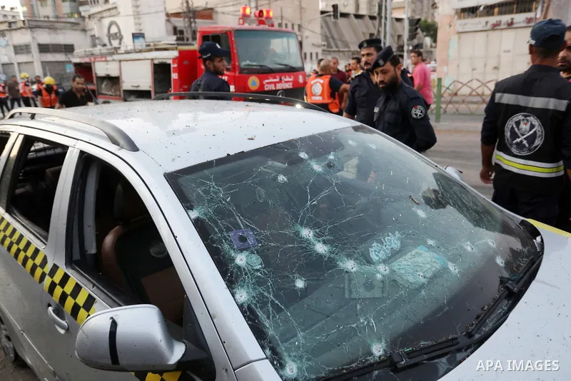 Palestinians inspect a car following an Israeli air strike in Gaza city on August 7, 2022. Latest figures by the Ministry of Health show that the number of Palestinians killed since the beginning of the Israeli aggressio...