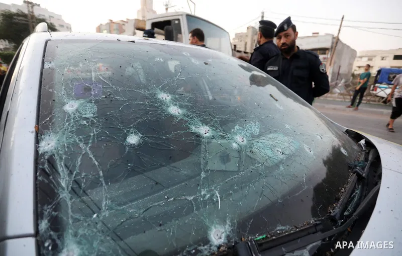 Palestinians inspect a car following an Israeli air strike in Gaza city on August 7, 2022. Latest figures by the Ministry of Health show that the number of Palestinians killed since the beginning of the Israeli aggressio...