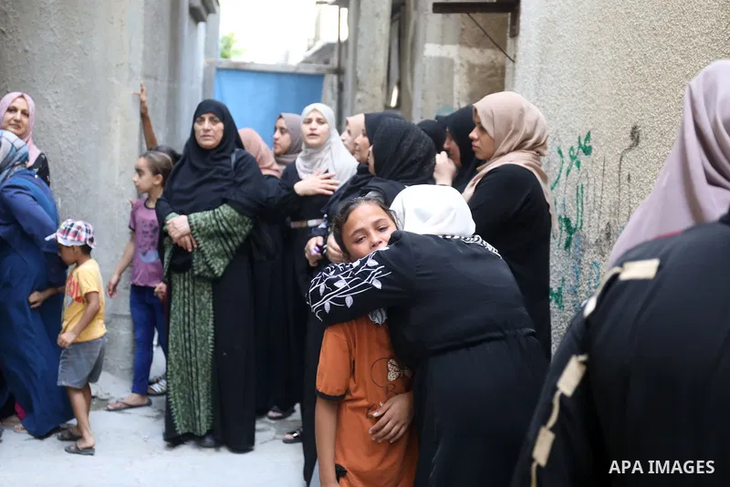 Palestinian Mourners carry the bodies of Najam family including children who were killed during an Israeli air strike on Sunday, during their funeral in Jabalia in the northern of Gaza strip on August 8, 2022. The cease-...