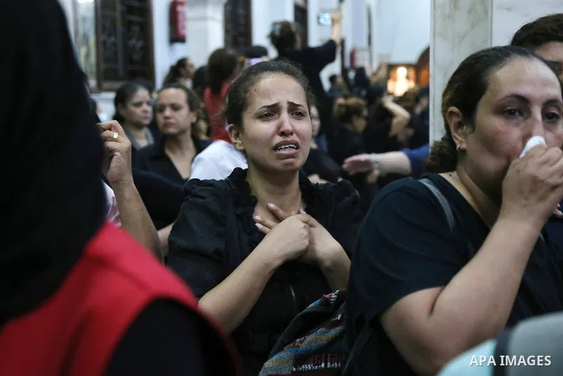 Egyptians react during the funeral of victims, who died due to the fire that broke out at the Abu Sifin church, inside the Church of the Blessed Virgin Mary at Warraq Al Arab district in Giza Governorate, Egypt, August 1...