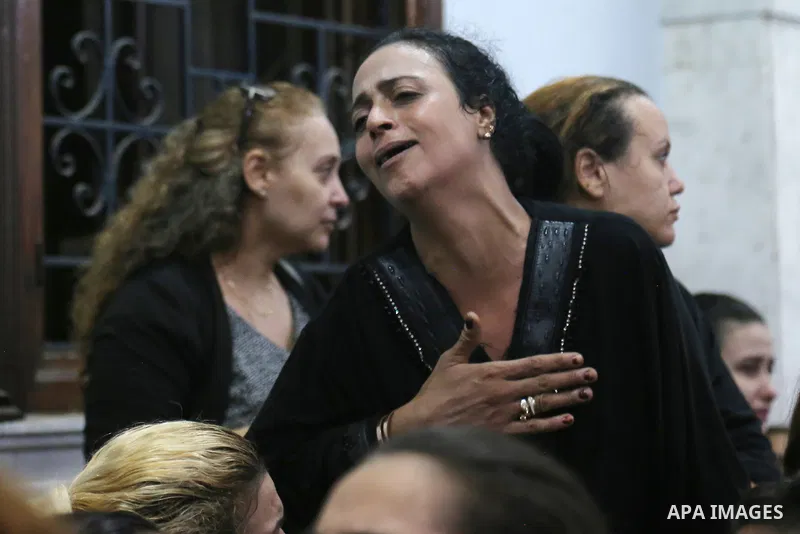 Egyptians react during the funeral of victims, who died due to the fire that broke out at the Abu Sifin church, inside the Church of the Blessed Virgin Mary at Warraq Al Arab district in Giza Governorate, Egypt, August 1...