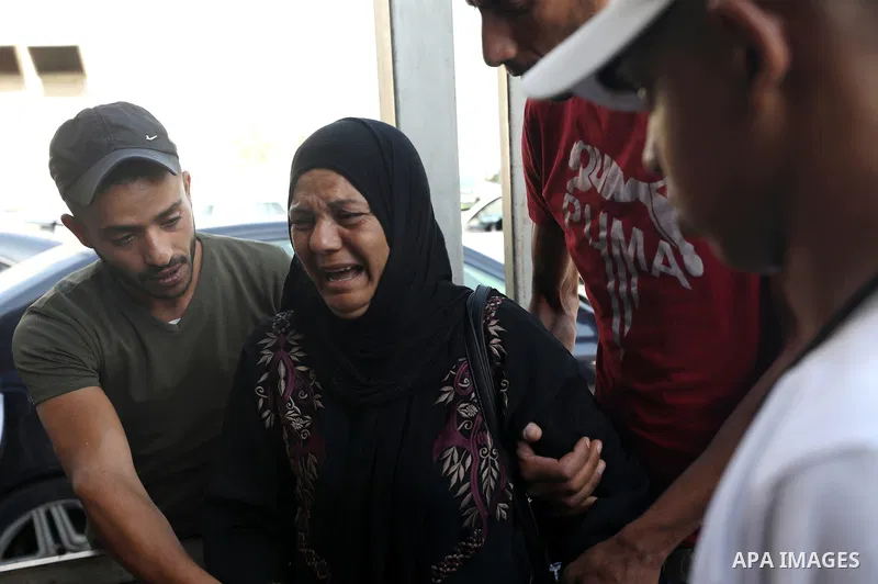 Mourners carry the body of Palestinian Wassim Khalifa, 19, killed by Israeli security forces during his funeral in the West Bank city of Nablus on August 18, 2022. Medics of the Specialized Arab Hospital confirmed that W...