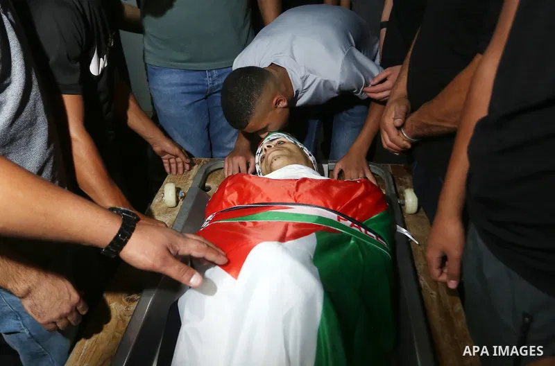 Palestinians attend the funeral Wassim Khalifa, 19, killed by Israeli forces in the West Bank city of Nablus on August 18, 2022. Medics of the Specialized Arab Hospital confirmed that Wasim Nasser Abu Khalifa, a 19-year-...