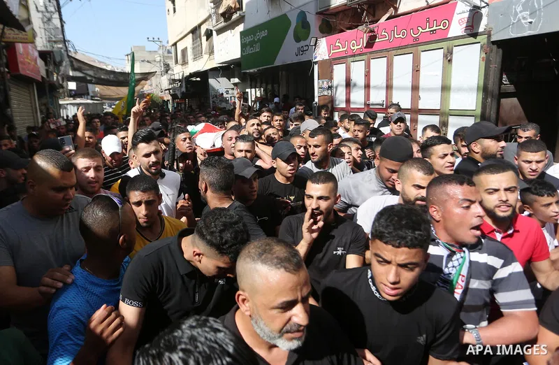 Palestinians attend the funeral Wassim Khalifa, 19, killed by Israeli forces in the West Bank city of Nablus on August 18, 2022. Medics of the Specialized Arab Hospital confirmed that Wasim Nasser Abu Khalifa, a 19-year-...