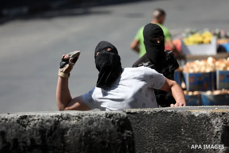 Clashes between Palestinian protesters and Israeli forces following a demonstration against settlement, in the West Bank city of Hebron on August 19, 2022. Photo by Mamoun Wazwaz