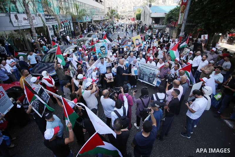 Palestinians protest demanding to hand over the bodies of Palestinians detained by the Israeli army, in the West Bank city of Nablus on August 27, 2022. Each Aug. 27, Palestinians commemorate, with various activities, th...