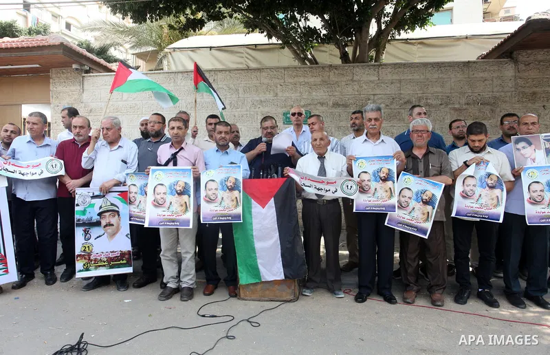 Palestinians take part in a protest in solidarity with prisoners on hunger strike in Israeli jails, in front of Red Cross office, in Gaza city on August 30, 2022. There are currently 4500 Palestinian freedom fighters inc...