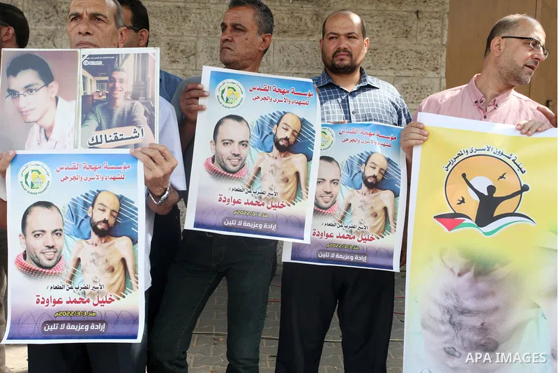 Palestinians take part in a protest in solidarity with prisoners on hunger strike in Israeli jails, in front of Red Cross office, in Gaza city on August 30, 2022. There are currently 4500 Palestinian freedom fighters inc...