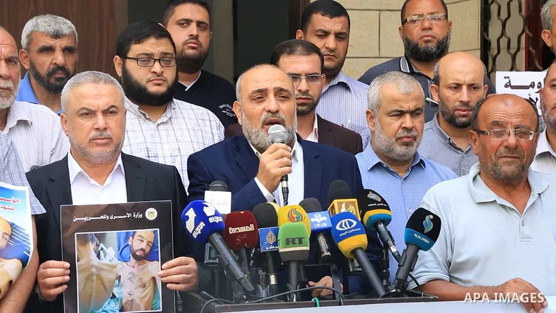 Members of Palestinian factions take part in a press conference in solidarity with prisoners on hunger strike in Israeli jails, in Gaza City on August 31, 2022. More than 4500 Palestinian freedom fighters incarcerated in...
