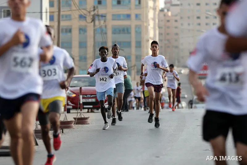 Palestinian runners participate in the Freedom Marathon on the occasion of Malaysian National Day, in Gaza city on August 31, 2022. Malaysia's Independence Day is celebrated on August 31st. Also known as Merdeka Day (Fre...
