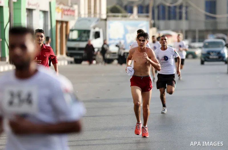 Palestinian runners participate in the Freedom Marathon on the occasion of Malaysian National Day, in Gaza city on August 31, 2022. Malaysia's Independence Day is celebrated on August 31st. Also known as Merdeka Day (Fre...