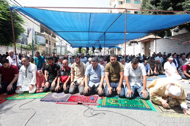 Palestinians attend Friday prayer in solidarity with pisoners in Israeli jails, in front of Red Cross office in Gaza city on September 02, 2022. The Palestinian Authority's committee for current and former detainees said...