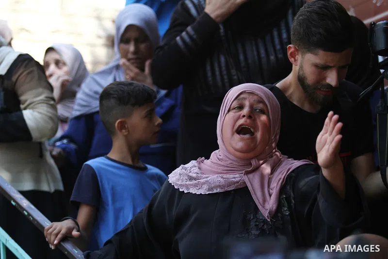 Mourners attend the funeral of 19 year-old Taher Zakarneh, who was killed during clashes with Israeli soldiers, in the Palestinian town of Qabatiya, near Jenin in the north of the Israeli-West Bank on September 5, 2022....