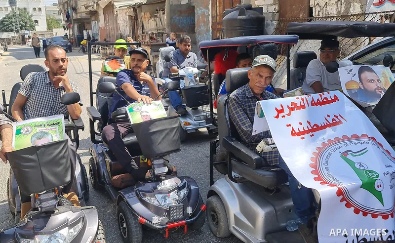 Palestinians take part in solidarity with pisoners in Israeli jails, marking the upcoming first anniversary of the Freedom Tunnel operation "Gilboa Tunnel", in front of the Red Cross headquarters in Khan Younis in the so...