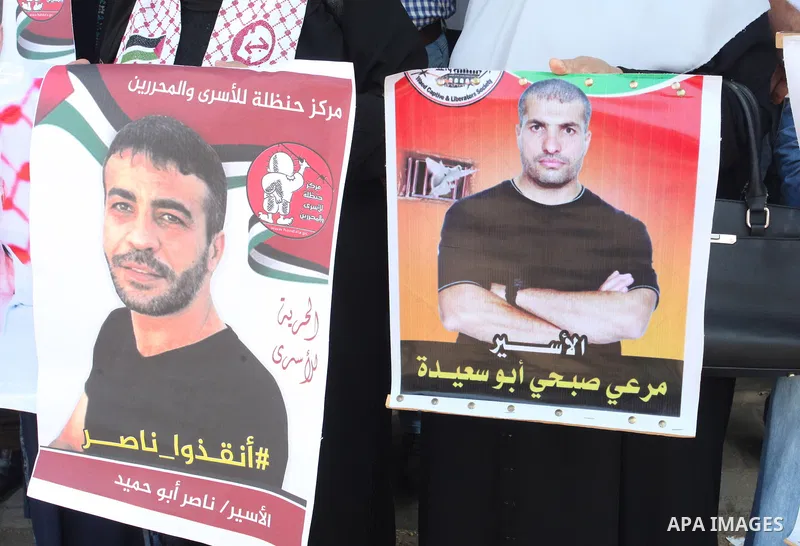 Palestinians take part in a protest in solidarity with prisoners on hunger strike in Israeli Jails in front of the headquarters of the Red Cross in Gaza City, on September 19, 2022. Israel’s widely condemned policy of ad...