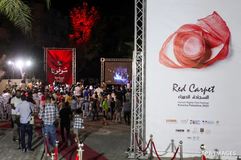 Palestinians attend the 6th Red Carpet Film Festival, in Gaza city on October 13, 2022. The Red Carpet Human Rights Film Festival is an annual festival for long, short, narrative, and documentary films held in the Gaza s...