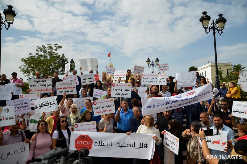 Tunisian journalists and human rights activists hold a protest in support of press freedom at the Kasba Square in Tunis October 13, 2022. Protesters carried banners and chanted slogans defending the democratic right to a...