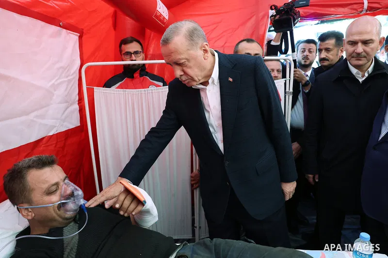 Turkish President Recep Tayyip Erdogan consoling wounded miners as he arrives to inspect the site of an explosion in a coal mine in Amasra, in Turkey's Bartin Province. Rescuers on October 15, 2022 searched for the last...