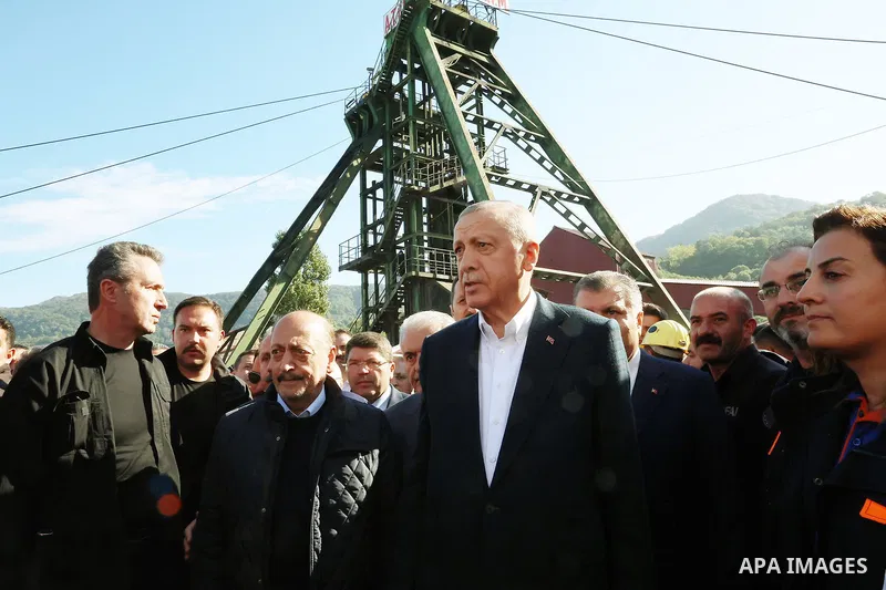 Turkish President Recep Tayyip Erdogan consoling wounded miners as he arrives to inspect the site of an explosion in a coal mine in Amasra, in Turkey's Bartin Province. Rescuers on October 15, 2022 searched for the last...