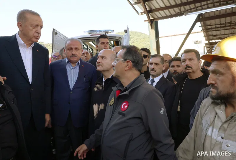 Turkish President Recep Tayyip Erdogan consoling wounded miners as he arrives to inspect the site of an explosion in a coal mine in Amasra, in Turkey's Bartin Province. Rescuers on October 15, 2022 searched for the last...