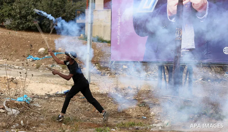 Palestinian protesters clash with Israeli troops following a demonstration near the Hawara checkpoint against Israel's blockade in Nablus, in the West Bank on October 21, 2022. Over the past nine days, Israel has shut do...
