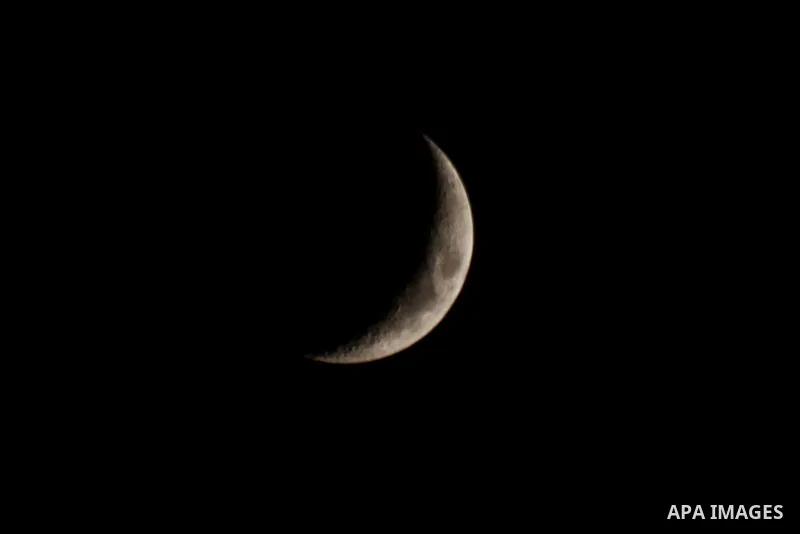 The crescent moon is seen in the sky of Gaza city on October 28, 2022. Photo by Ali Hamad\ apaimages