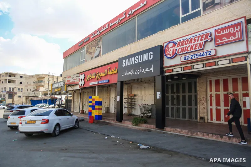 Shuttered shops are seen in the town of al-Eizariya, east of the city of Jerusalem during a general strike, in mourning of a Palestinian resident killed by Israeli forces yesterday in Jericho on October 31, 2022. All sho...