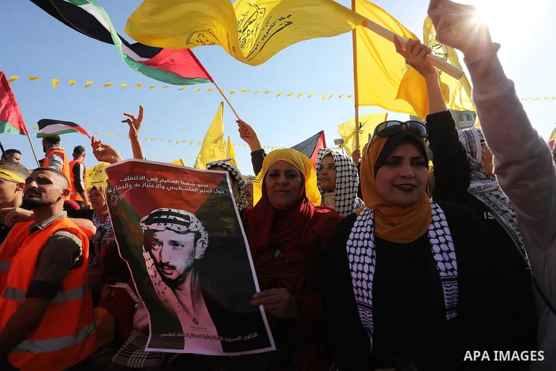 Palestinian supporters of Fatah movement attends the festival marking the 18th anniversary of the death of the late Palestinian President Yasser Arafat, in Gaza city on November 10, 2022. Arafat, also known as Abu Ammar...