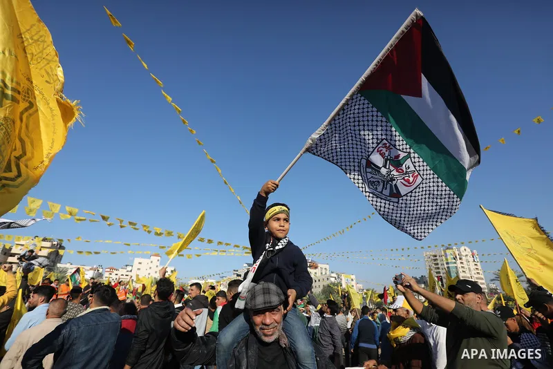 Palestinian supporters of Fatah movement attends the festival marking the 18th anniversary of the death of the late Palestinian President Yasser Arafat, in Gaza city on November 10, 2022. Arafat, also known as Abu Ammar...