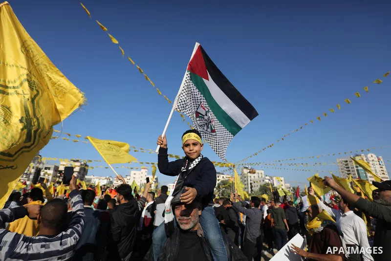 Palestinian supporters of Fatah movement attends the festival marking the 18th anniversary of the death of the late Palestinian President Yasser Arafat, in Gaza city on November 10, 2022. Arafat, also known as Abu Ammar...