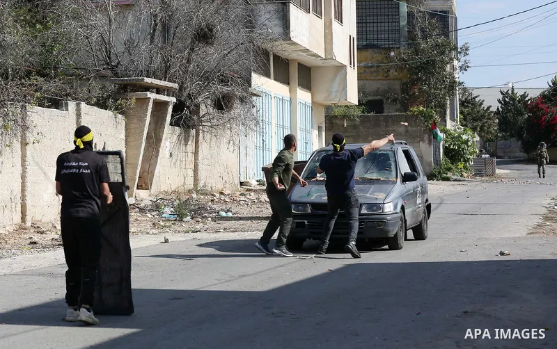 Palestinian demonstrators clash with Israeli forces, following a protest against the expropriation of Palestinian land by Israel, in the West Bank village of Kfar Qaddum near the Jewish settlement of Kedumim on November...
