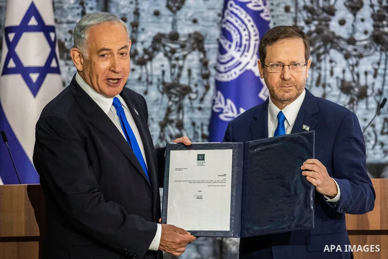 Likud leader and former Israeli prime minister Benjamin Netanyahu (L) receives mandate from Israeli President Isaac Herzog to form a government at the President's Residence 13 November 2022, Israel, Jerusalem. (Credit Im...