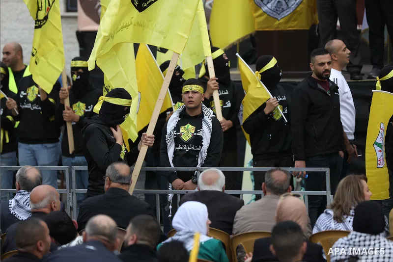 Palestinian supporters of Fatah movement attends the festival marking the 18th anniversary of the death of the late Palestinian President Yasser Arafat, in the West Bank city of Nablus on November 14, 2022. Arafat, also...