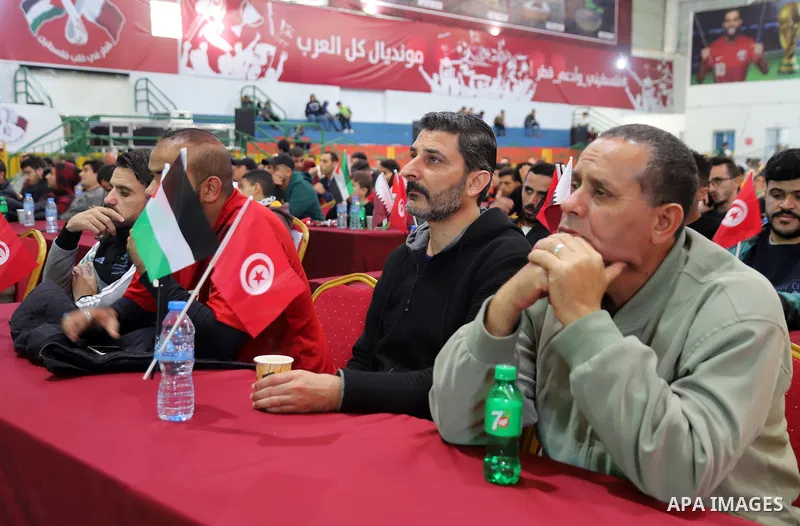Palestinian fans gather at a public place to attend FIFA World Cup 2022 match between Tunisia and Australia in Gaza city on November 26, 2022. Photo by Youssef Abu Watfa \ apaimages