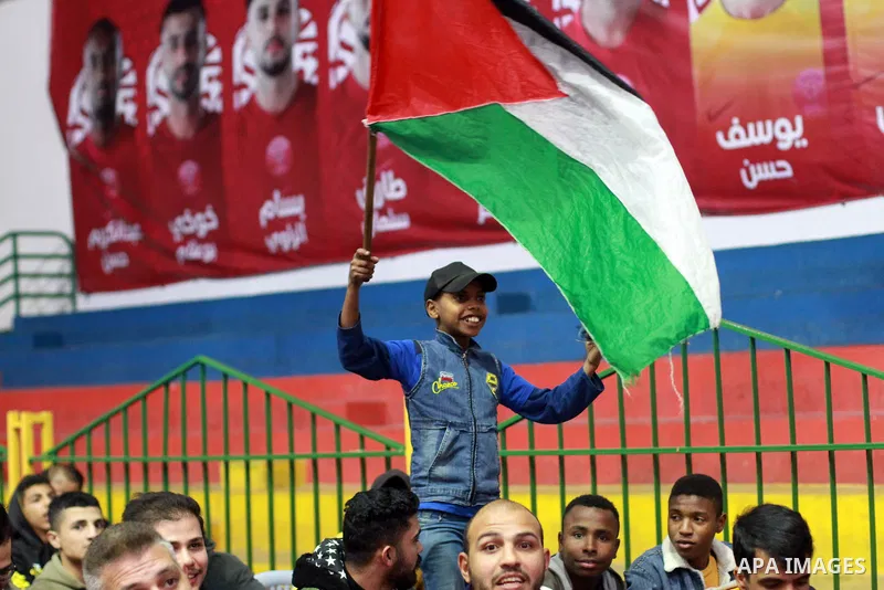 Palestinian fans gather at a public place to attend FIFA World Cup 2022 match between Spain and Germany in Gaza city on November 27, 2022. Photo by Ali Hamad\ apaimages
