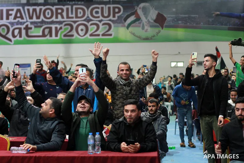 Palestinian fans gather at a public place to attend FIFA World Cup 2022 match between Spain and Germany in Gaza city on November 27, 2022. Photo by Ali Hamad\ apaimages