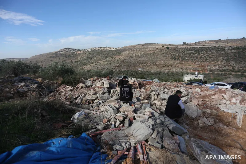 Palestinians inspect the rubble of houses which were demolished by the Israeli army in Kufr al-Dik town, in the north of the West Bank on November 28, 2022. The Israeli authorities today demolished a Palestinian-owned ho...