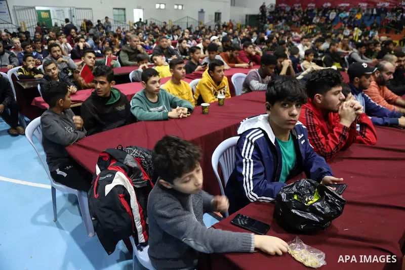 Palestinian fans attend the match between Morocco VS Canada, in the Qatar World Cup FIFA 2022, via a huge screen at a public place in Gaza city on December 1, 2022. The 2022 FIFA World Cup is an association football tour...