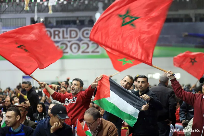 Palestinian fans celebrate after Morocco's victory over Spain in the World Cup in Qatar 2022, in Gaza city on December 6, 2022. Photo by Ali Hamad\ apaimages