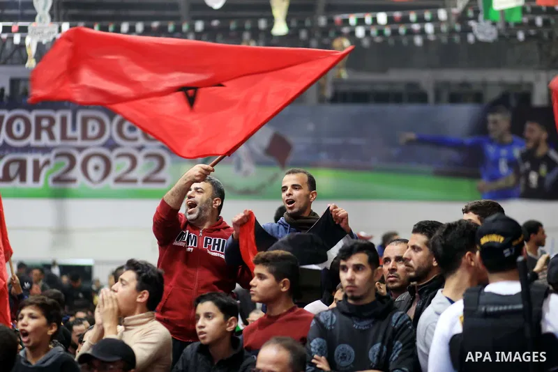 Palestinian fans celebrate after Morocco's victory over Spain in the World Cup in Qatar 2022, in Gaza city on December 6, 2022. Photo by Ali Hamad\ apaimages