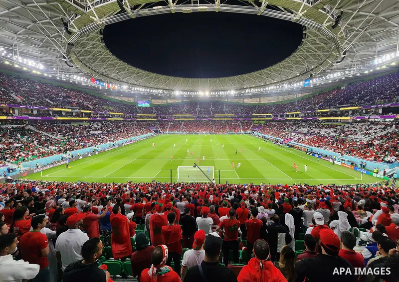 Fans cheer in the stadium during Morocco vs Portugal match in FIFA World Cup, in Doha, Qatar on December 10, 2022. The 2022 FIFA World Cup is an association football tournament, contested by the men's national teams of F...