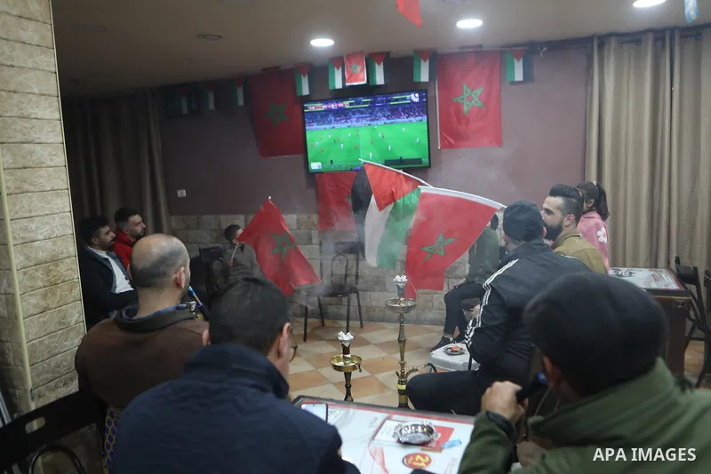 Palestinian celebrate historic victory over Portugal in a 2022 FIFA World Cup match, in the West Bank in Hebron, in the Israeli-occupied West Bank December 10,2022. Photo by Mamoun Wazwaz