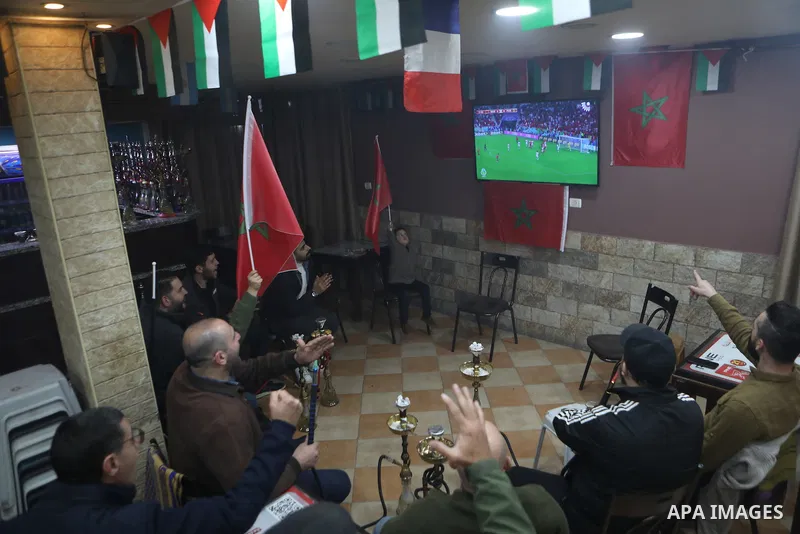 Palestinian celebrate historic victory over Portugal in a 2022 FIFA World Cup match, in the West Bank in Hebron, in the Israeli-occupied West Bank December 10,2022. Photo by Mamoun Wazwaz