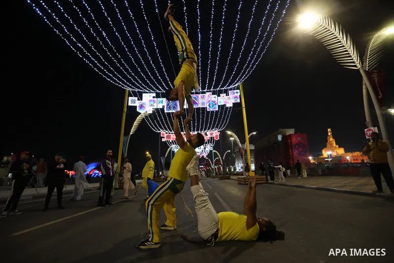 Fans and tourists attend a Mexican show on the Corniche promenade in Doha during the Qatar 2022 World Cup football tournament on December 11, 2022. The 2022 FIFA World Cup is an association football tournament, contested...