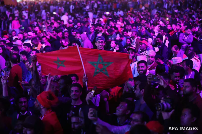 Fans attend on a huge screen the semi-final match between Morocco and France on the Doha Corniche on December 14, 2022. The 2022 FIFA World Cup is an association football tournament, contested by the men's national teams...