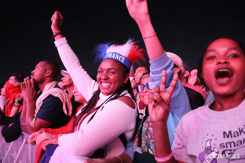 Fans attend on a huge screen the semi-final match between Morocco and France on the Doha Corniche on December 14, 2022. The 2022 FIFA World Cup is an association football tournament, contested by the men's national teams...