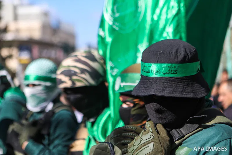 Supporters of the Palestinian Islamist movement Hamas gather for a rally marking the 35th anniversary of the group's foundation, in the West Bank city of Hebron on December 16, 2022. Photo by Mamoun Wazwaz/APAimages